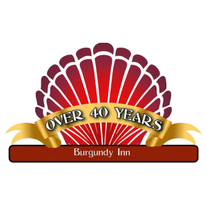The Burgundy Inn / Vacations by the Ocean logo